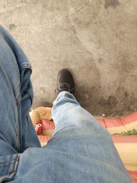 Low section of man standing on floor