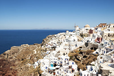 High angle view of oia village by sea at santorini