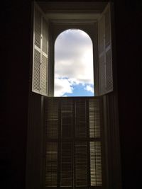 Low angle view of building against cloudy sky