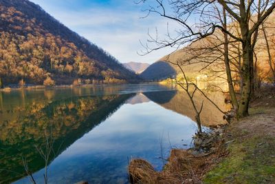 Scenic view of lake and mountains against sky