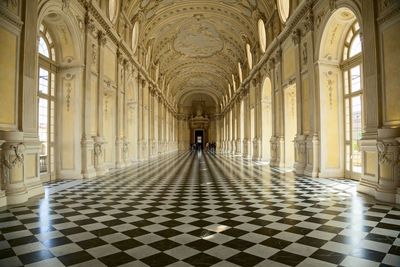 Man walking in corridor of historic building