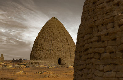 Tombs of old dongola cemetery and tombs in the north of the sudanese desert, africa