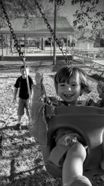 Children playing on seesaw at playground