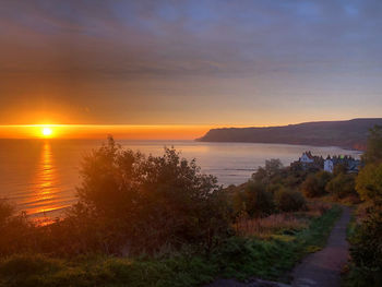 Scenic view of sea against sky during sunset