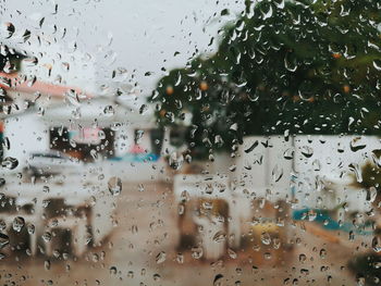 Full frame shot of wet glass window in rainy season