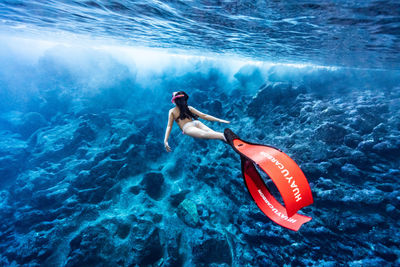 High angle view of man swimming in sea