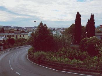 Road with buildings in background