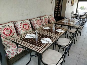 High angle view of empty chairs and table at home