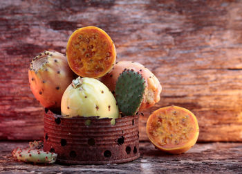 Fruits in metal container on table