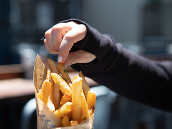 Close-up of hand holding food