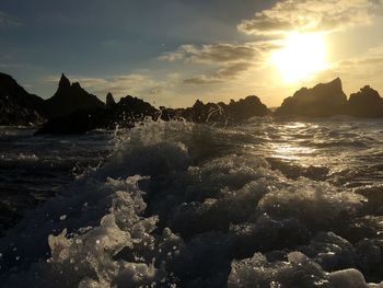 Scenic view of sea against sky at sunset