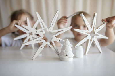 Cute sibling making decoration at home