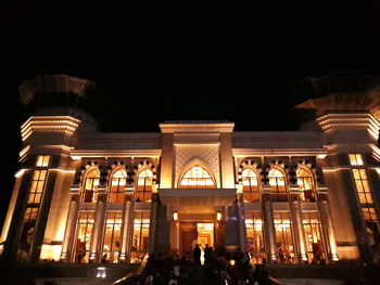 Low angle view of illuminated building at night