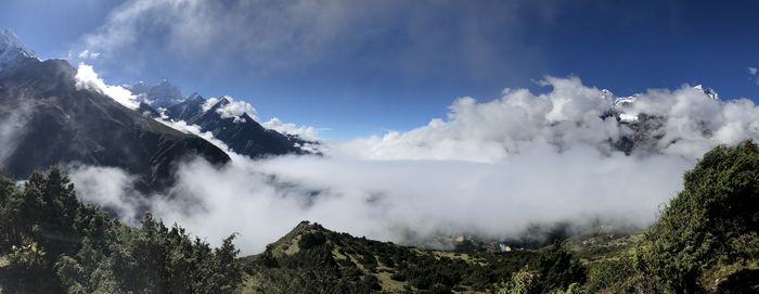 Panoramic view of snowcapped mountains against sky