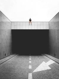 Man sitting on top of a tunnel