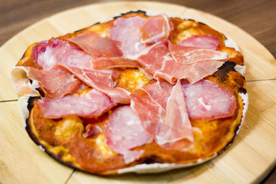 Close-up of homemade pizza in plate on table