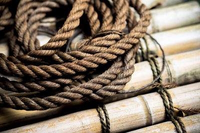 Close-up of rope tied on wood