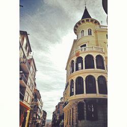 Low angle view of clock tower against sky