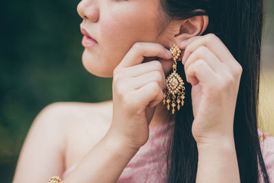 Close-up of woman wearing earring