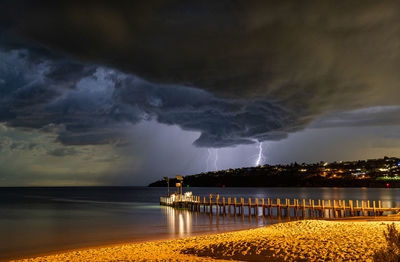 Lightning storm over harbour with a menacing cloud scene