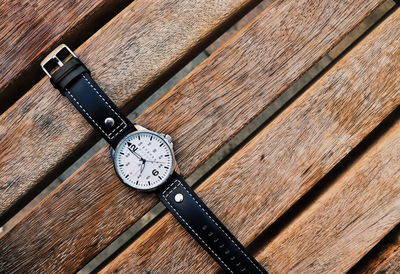 High angle view of clock on table