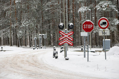 Railway crossing on a snowy winter day