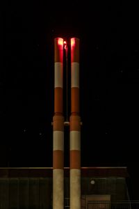 Close-up of illuminated lamp against black background