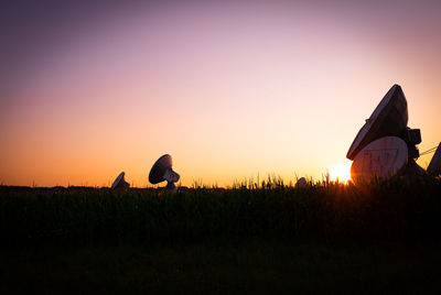 Scenic view of field against sky during sunset