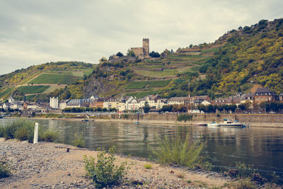 View of town against cloudy sky