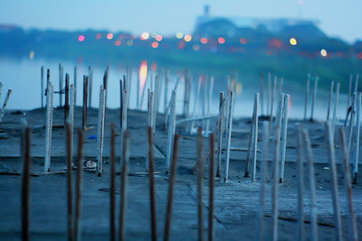 Build structure in the river against sky at dusk