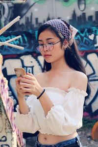 Young woman using mobile phone