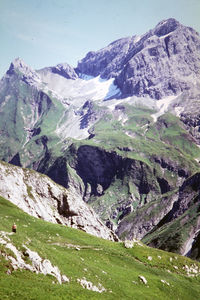 Scenic view of snowcapped mountains against sky