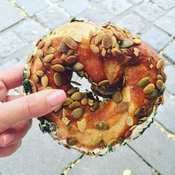 Close-up of hand holding pretzel