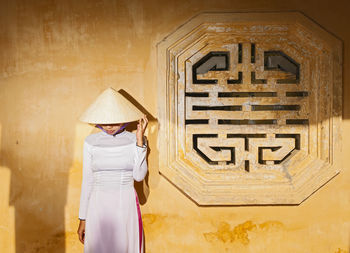 Beautiful woman exploring the imperial palace in hue / vietnam