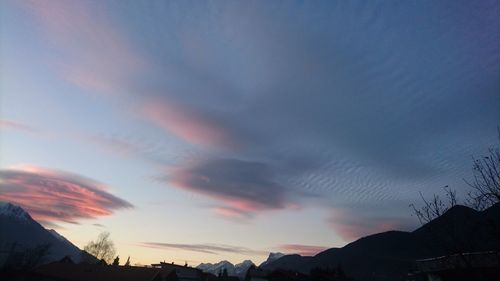 Scenic view of silhouette landscape against sky at sunset