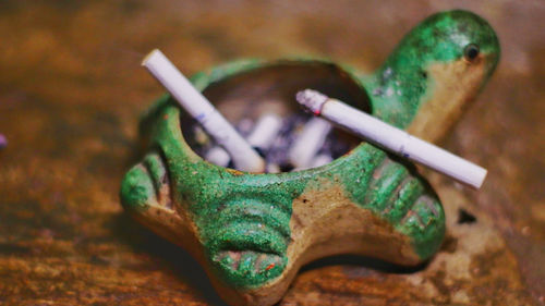 High angle view of cigarette on table