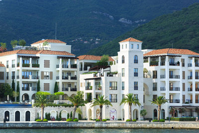 Buildings against mountains at adriatic sea