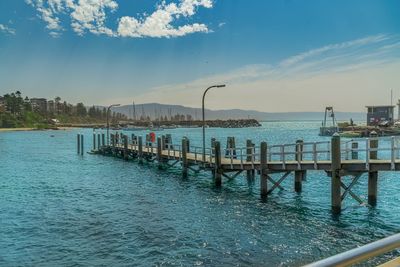 Pier over sea against sky