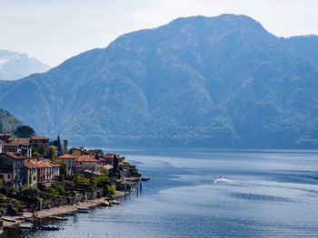 Scenic view of sea and mountains against sky