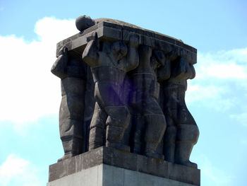 Low angle view of statue against sky