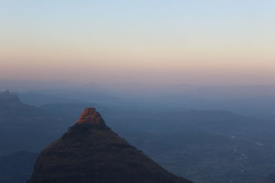 Scenic view of mountain against sky during sunset