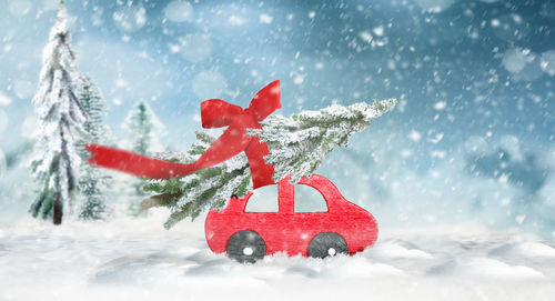 Close-up of red christmas tree in snow