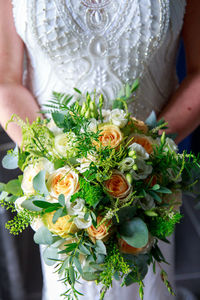 Woman holding flower bouquet