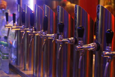 Row of beer taps at microbrewery