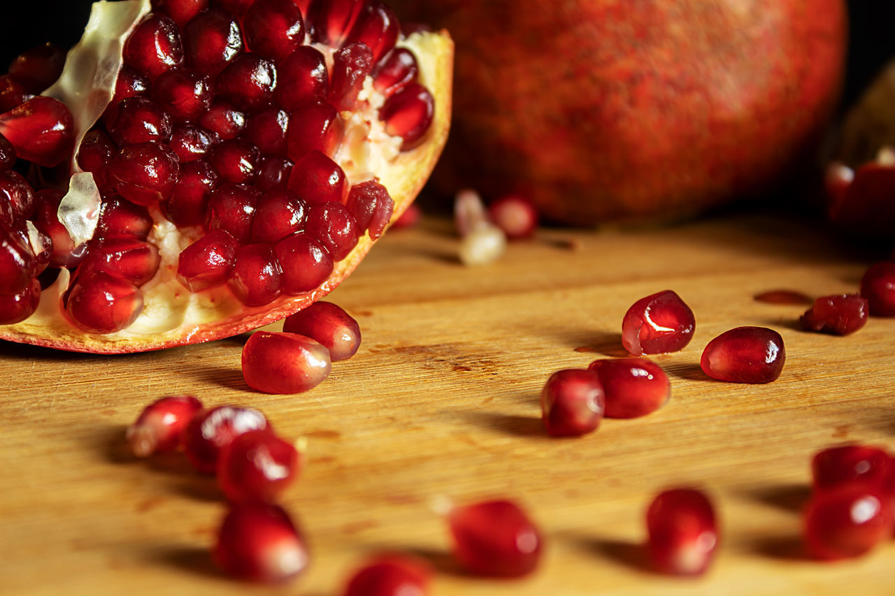 CLOSE-UP OF CHERRIES ON TABLE