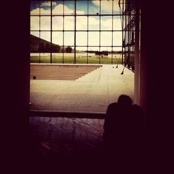 Close-up of silhouette person against window