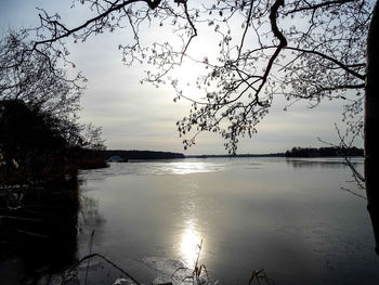 Scenic view of lake against sky at sunset