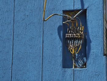 Directly above shot of old lamp hanging on wall