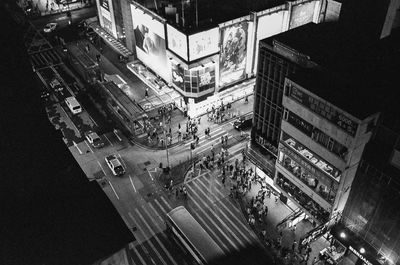 High angle view of city street and buildings at night