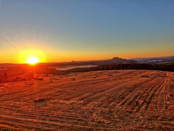 Scenic view of landscape against sky during sunset